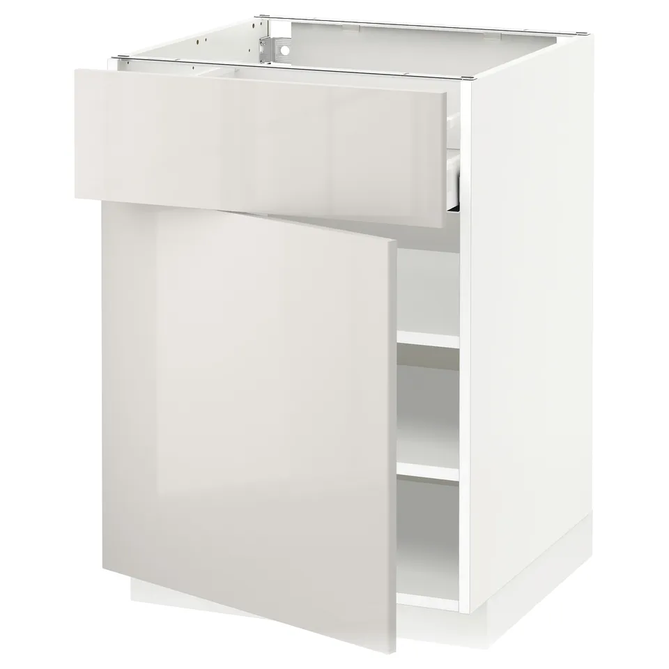 A white kitchen cabinet from IKEAs METOD series in high gloss. It has a sleek design with a single door and an adjustable shelf inside.