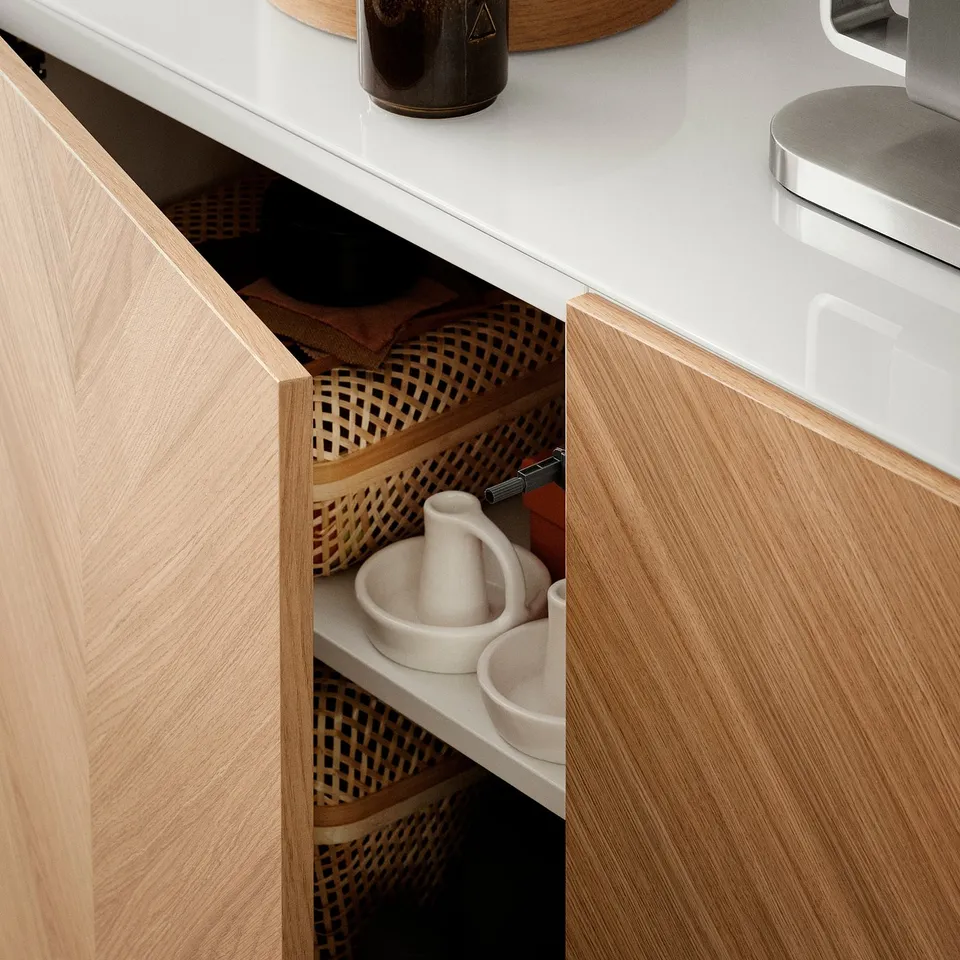 Wooden drawer open showing containers.