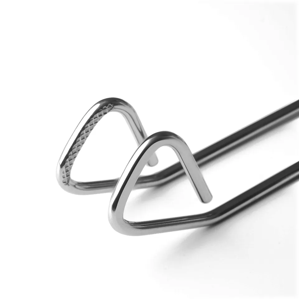 Stainless steel tongs with textured grips; one bent over the other, showcasing sturdy design and quality.