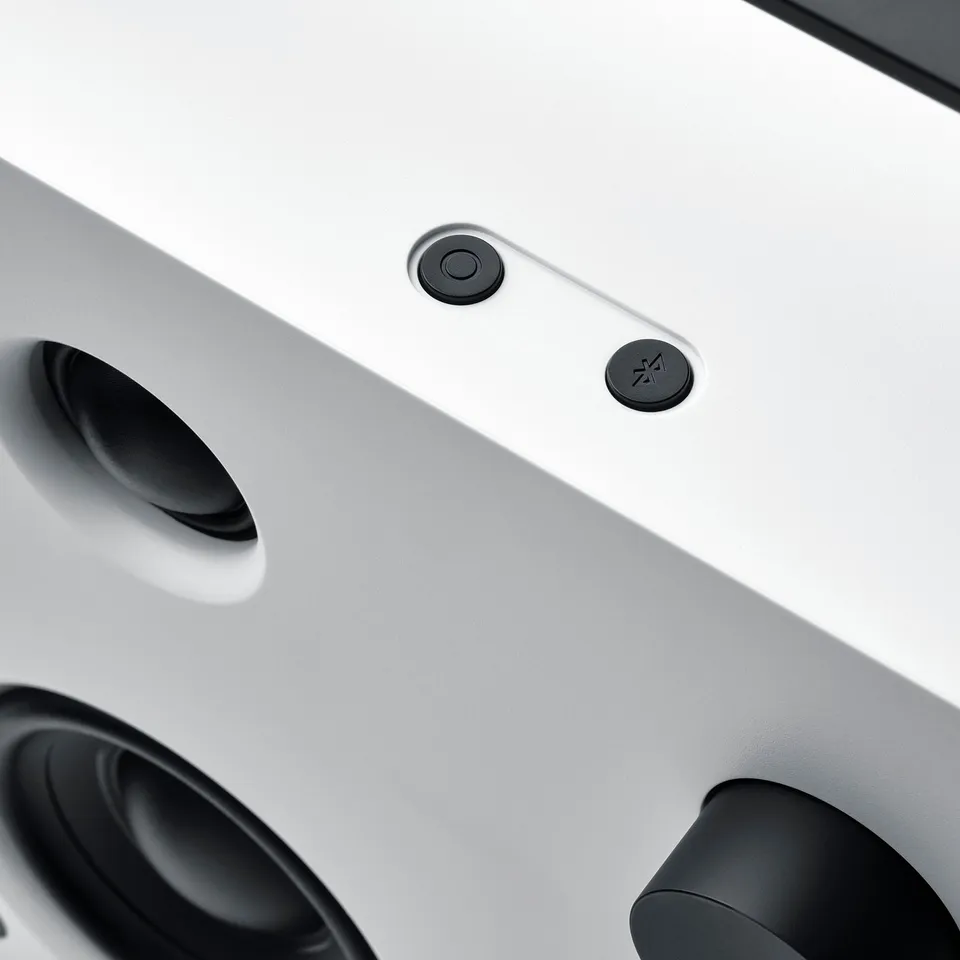 Modern speaker with sleek design, featuring precise controls and robust speakers.