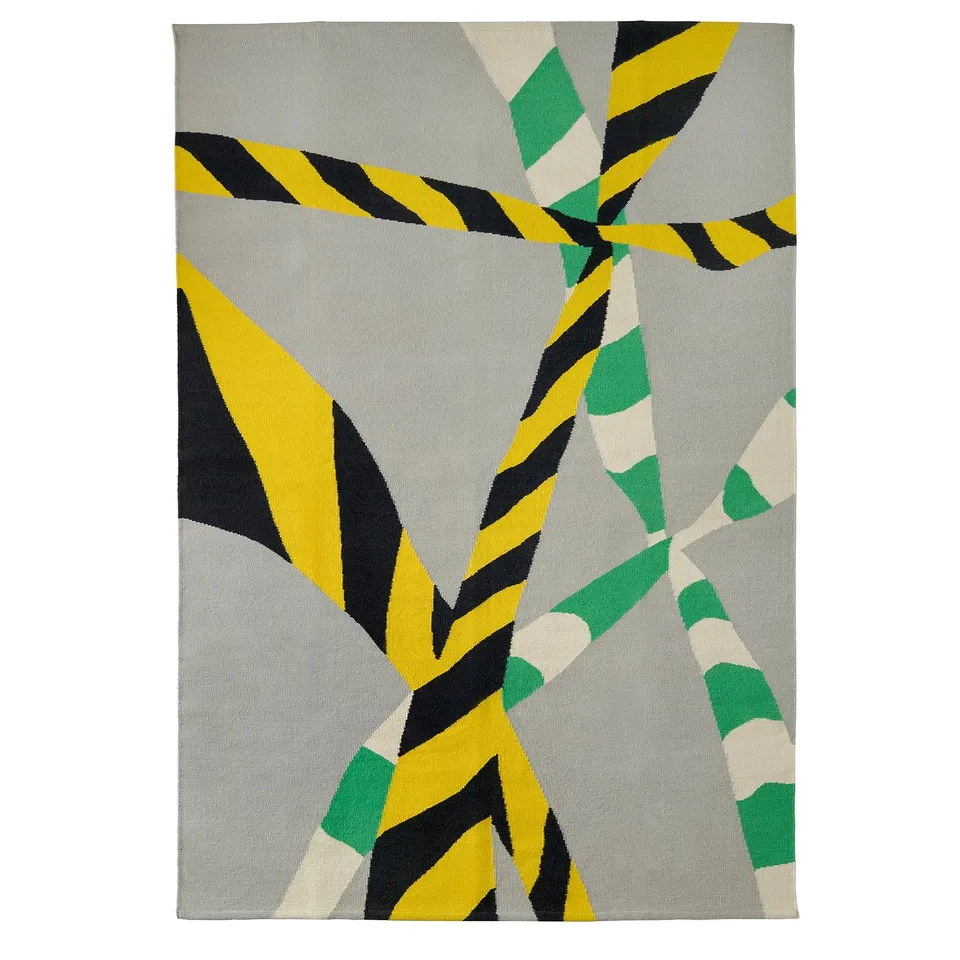 KONSTRUNDA rectangular rug, grey base, yellow, black, green accents, geometric pattern.