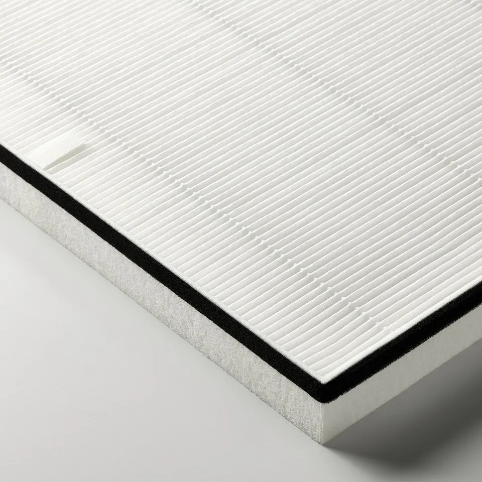 Clean air philtre close-up. White grid pattern framed in black, set on grey base.