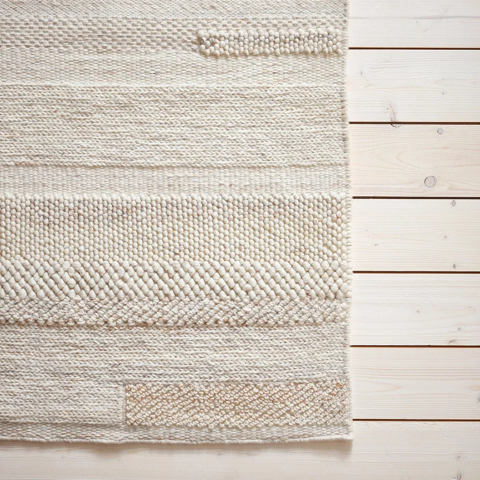 BRÖNDEN beige wool rug, handwoven, textured, neutral, natural, durable, eco-friendly, natural fibres.