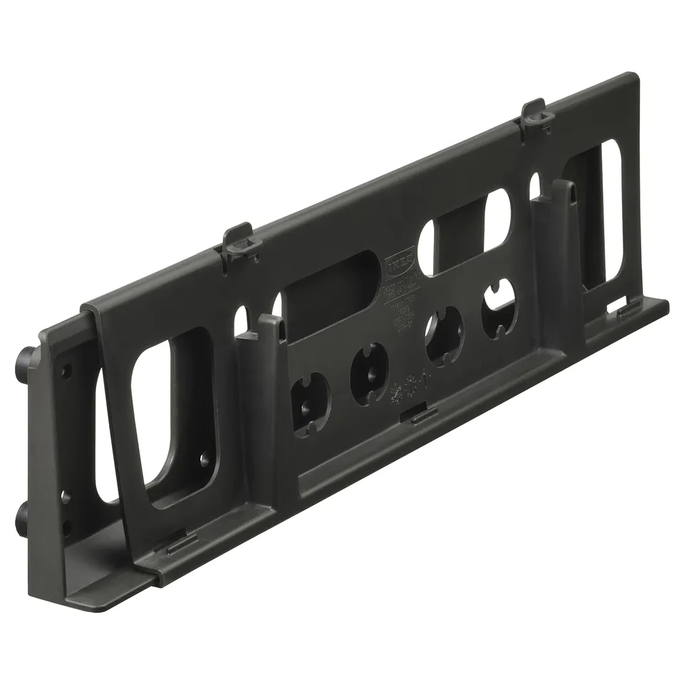 A black plastic storage slider device designed to fit under sinks or in cabinets, aiding in organising small items like sponges and brushes.