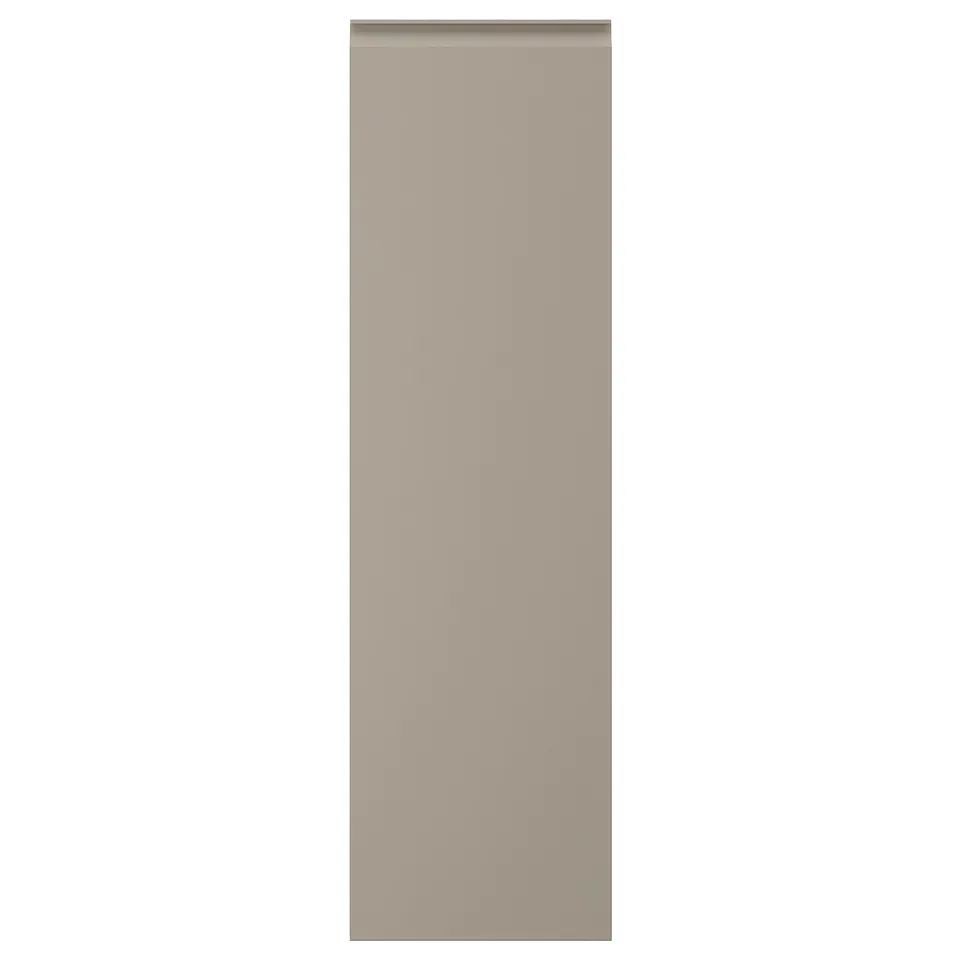 Beige kitchen cabinet with chamfered edges, matt finish.