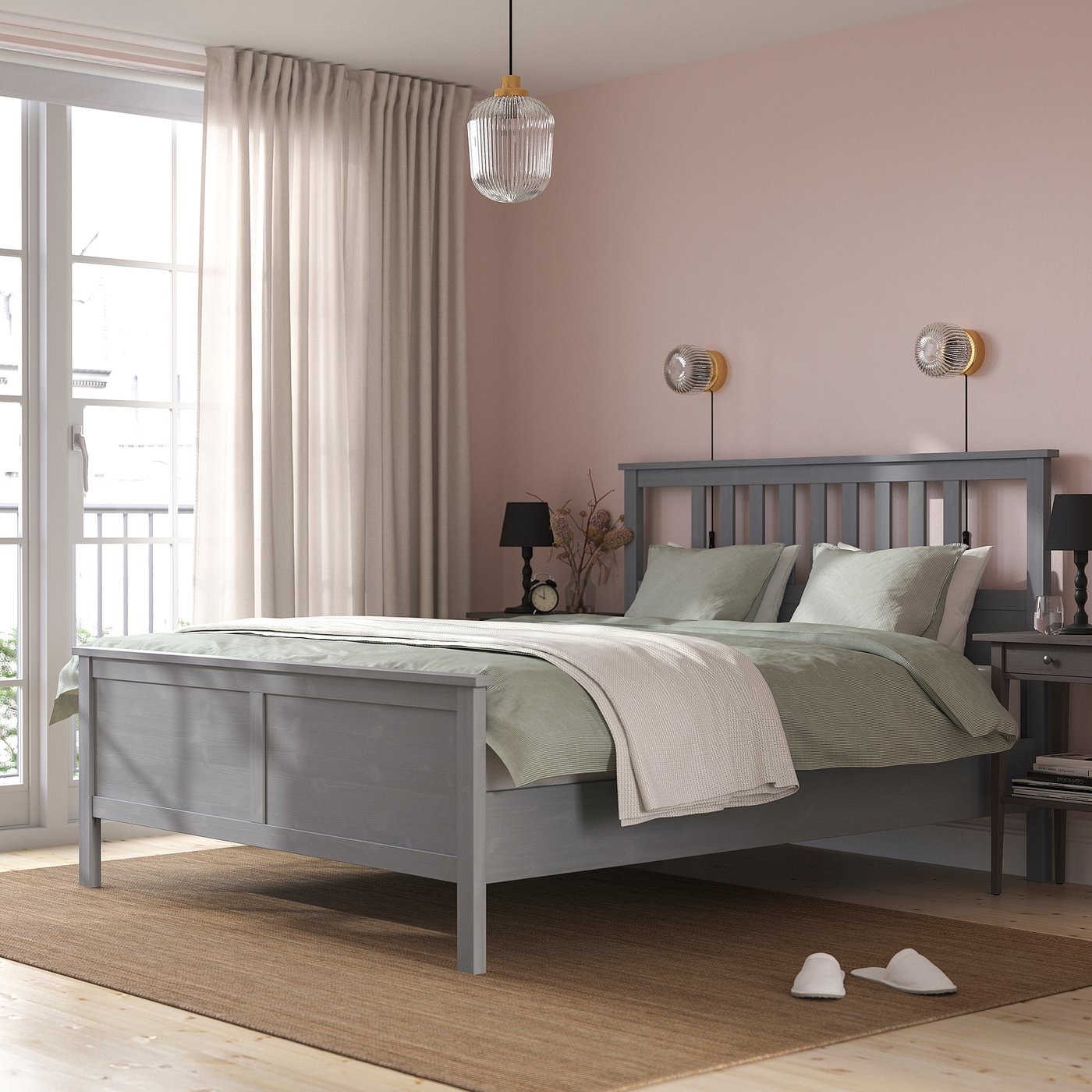 Modern grey HEMNES bed in solid pine stands tall, wide, & stylish with light linens, nightstands & large window. Its larger relative to room items.