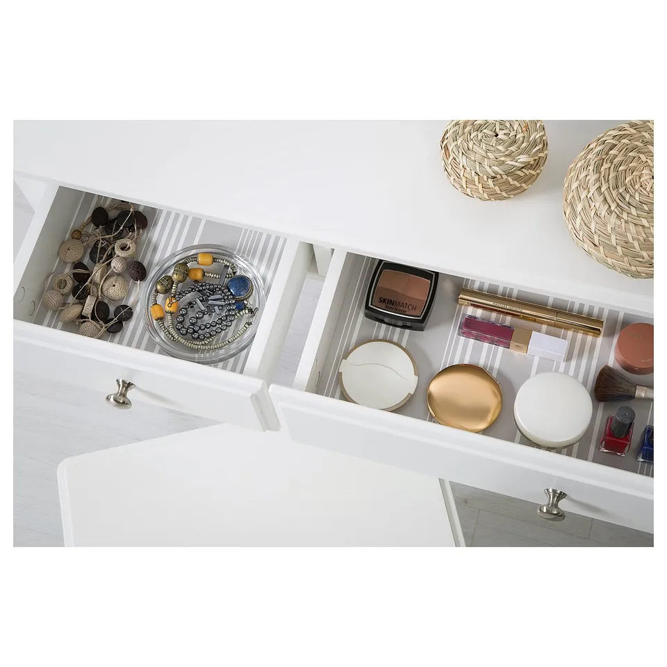 Open vanity drawer showing jewellery and cosmetics, soft closing mechanism.