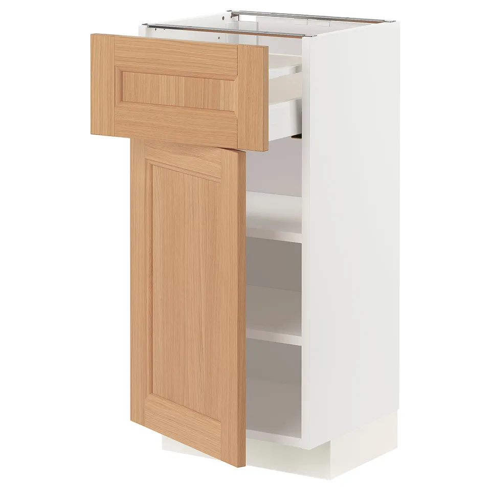 A white METOD kitchen cabinet with a wooden door and drawer, featuring a natural, warm design and sturdy construction.