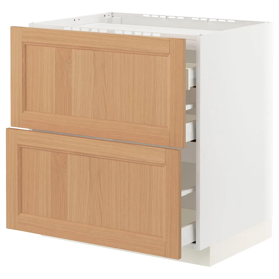 A METOD kitchen cabinet with an oak finish. It wooden drawers and a robust frame, designed for durability and storage.
