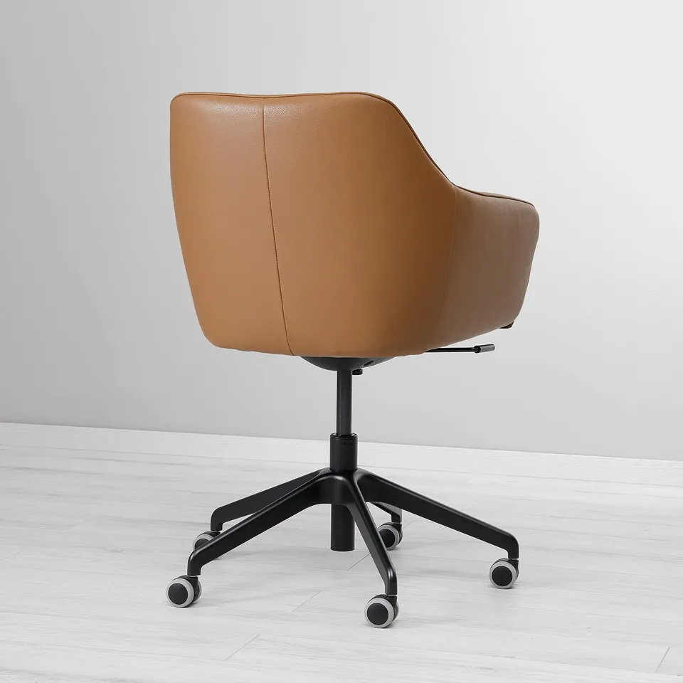 Brown leather office chair with padded seat & back, rolling casters, adjustable tilt, comfortable foam.