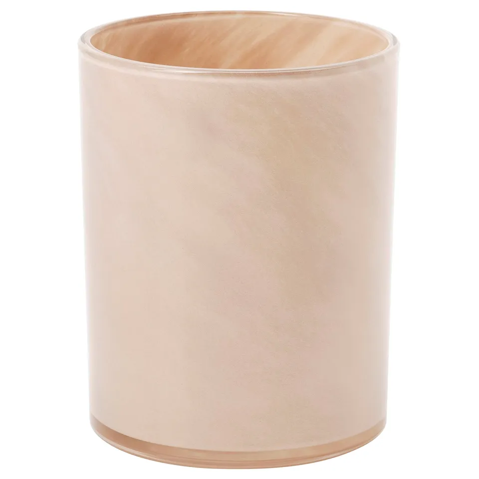 VINDSTILLA: pale pink, cylindrical glass candle holder. Decorative pattern glows warmly when lit.