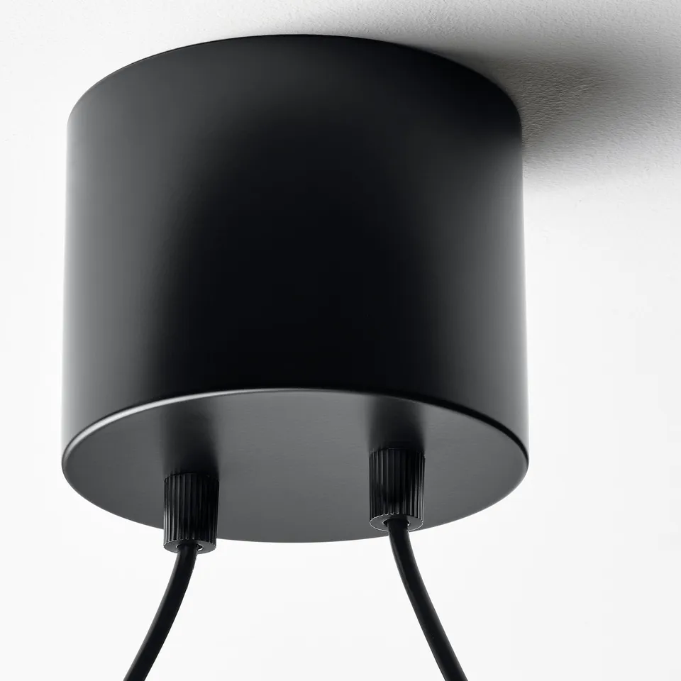 Black cylindrical ceiling lamp; stylish, modern design. Adjustable height, three attached wires.