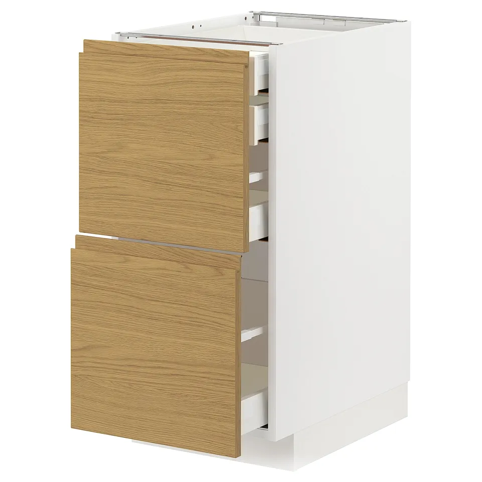 Modern kitchen unit with oak-effect drawers and white cabinet. Four drawers in sleek design.