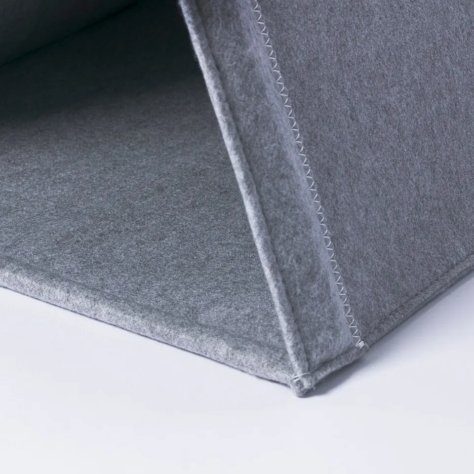 Close-up of grey cat tents sturdy stitching, showcasing quality craftsmanship.