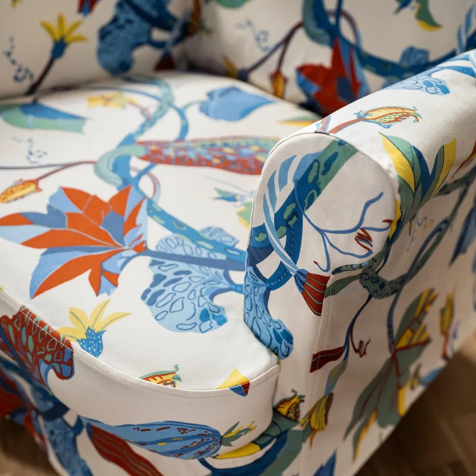 Tropical leaf-patterned chair slipcover, colourful & durable.