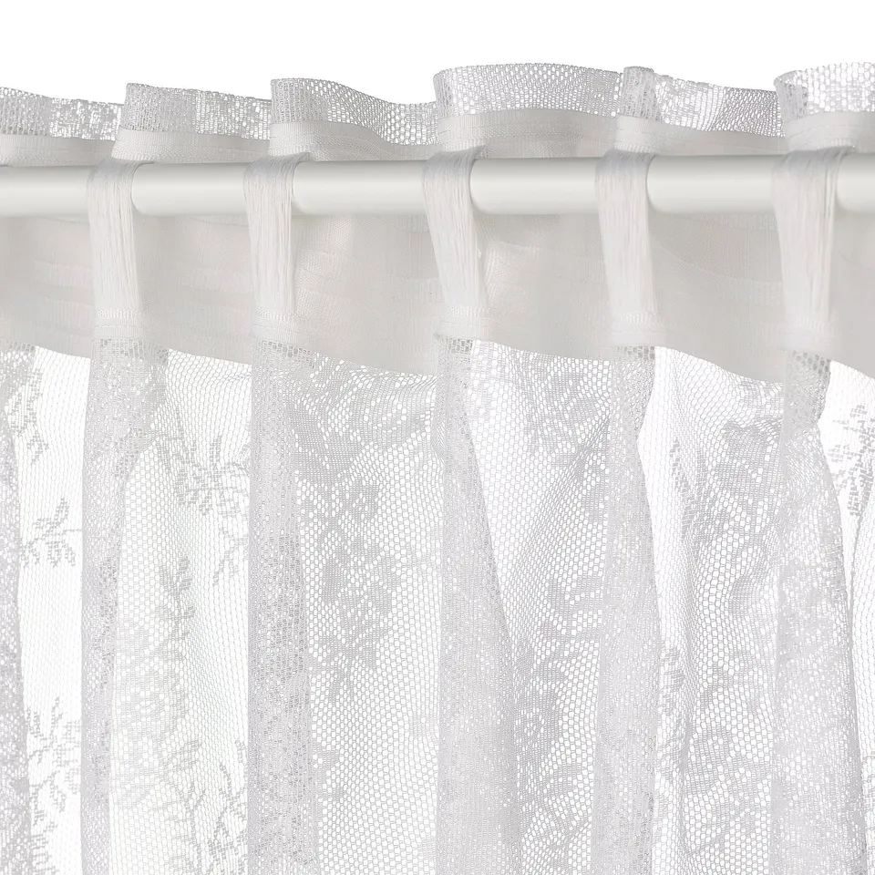 Lace curtains with floral patterns, privacy, light diffusion.
