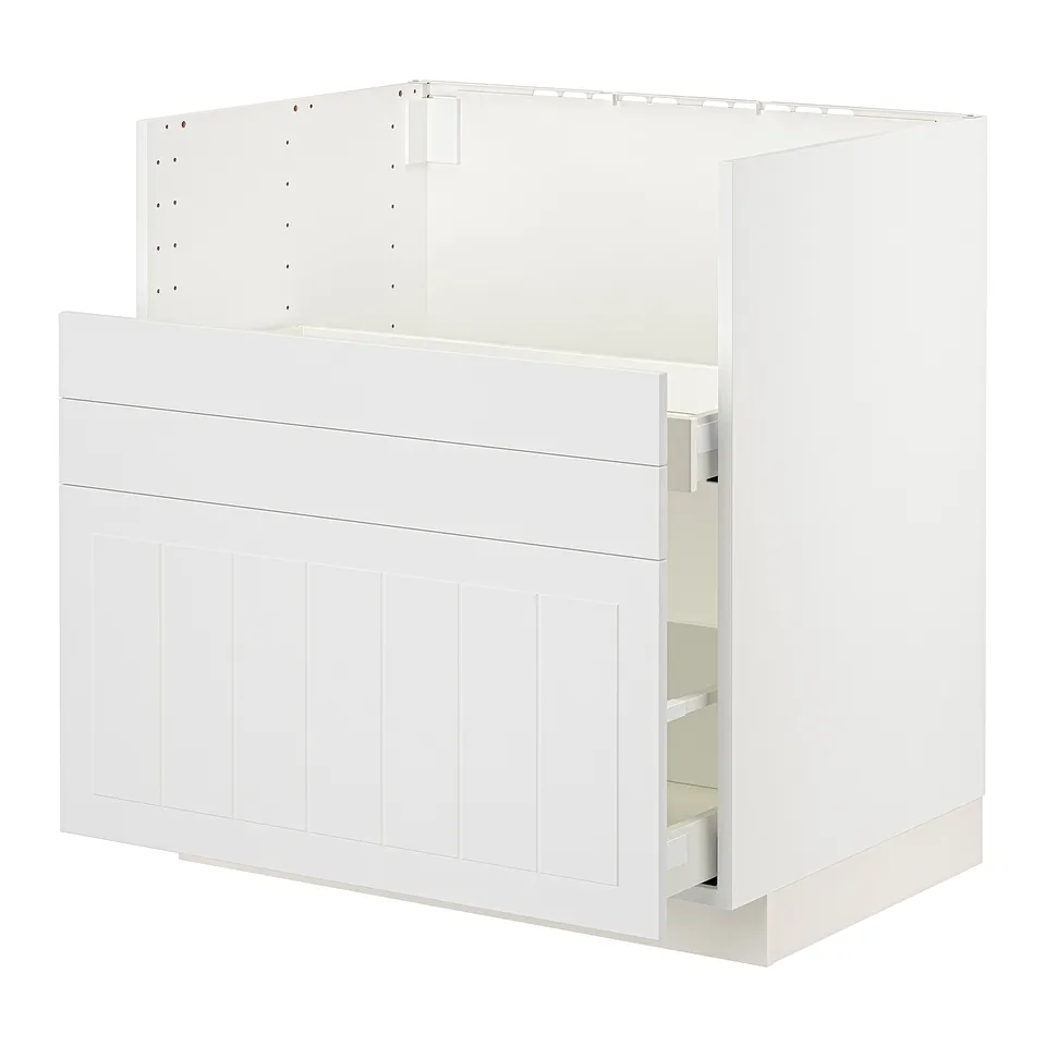 A white METOD kitchen cabinet, featuring a smooth drawer and sturdy construction.
