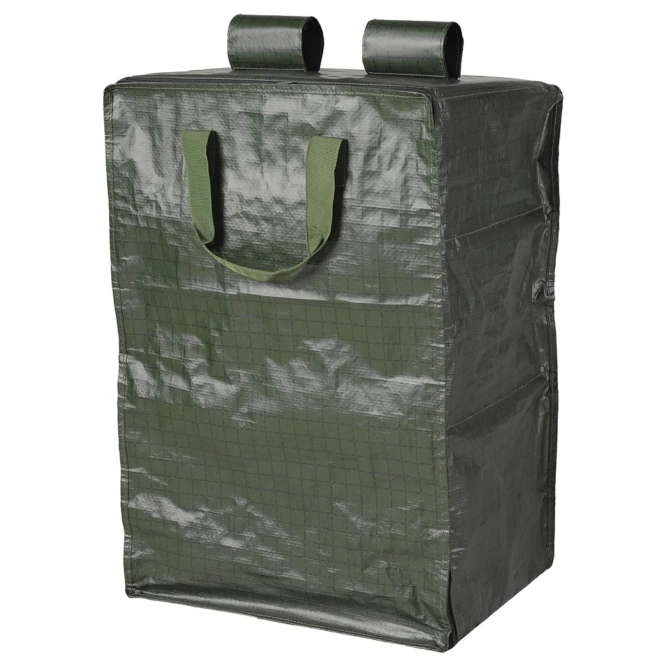 Green KOMPISHÄNG storage bag, rectangular, zip closure, handle & shoulder straps.