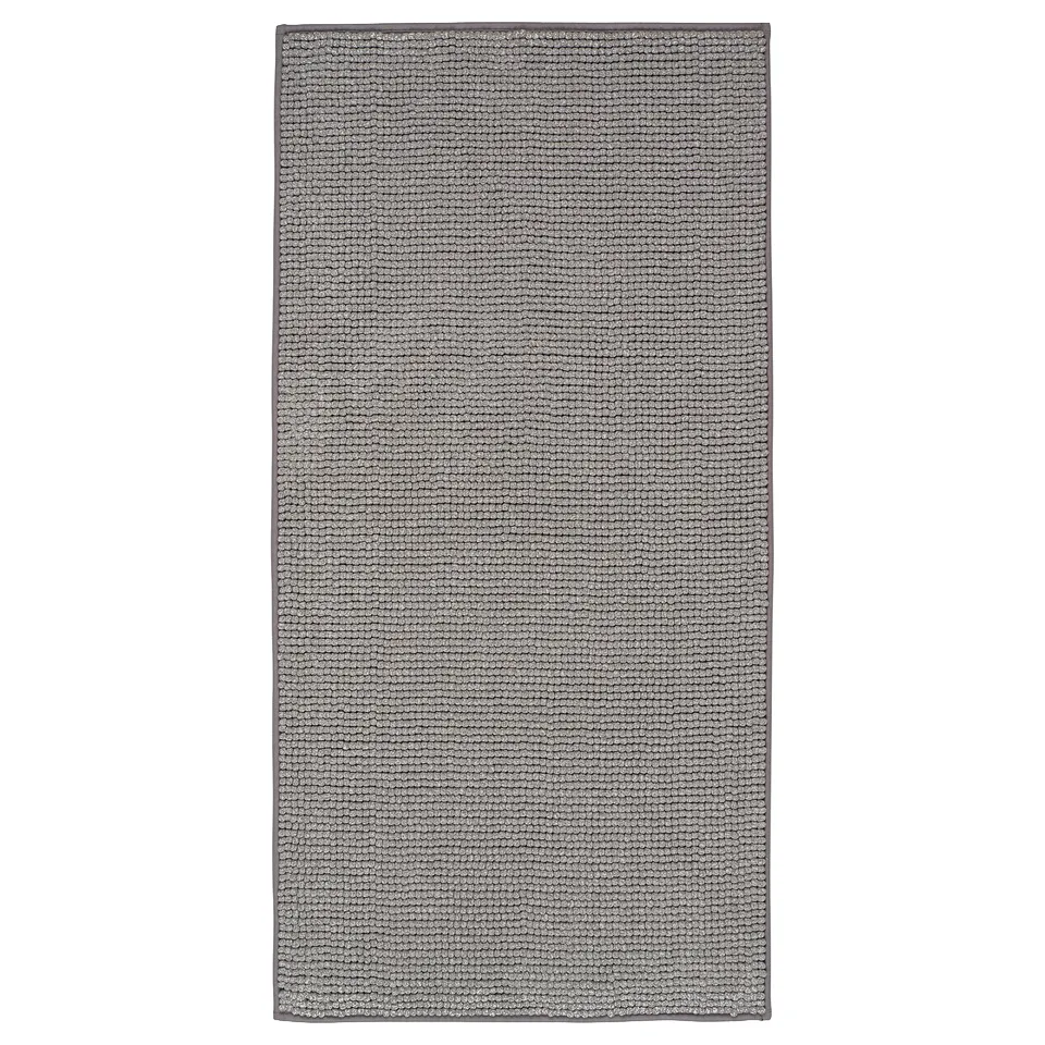 A TOFTBO grey bath mat, rectangular, made from soft, recycled polyester fibres, with a textured design for comfort and quick drying.