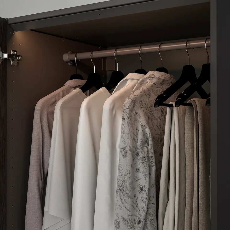 Led-lit closet with clothes.