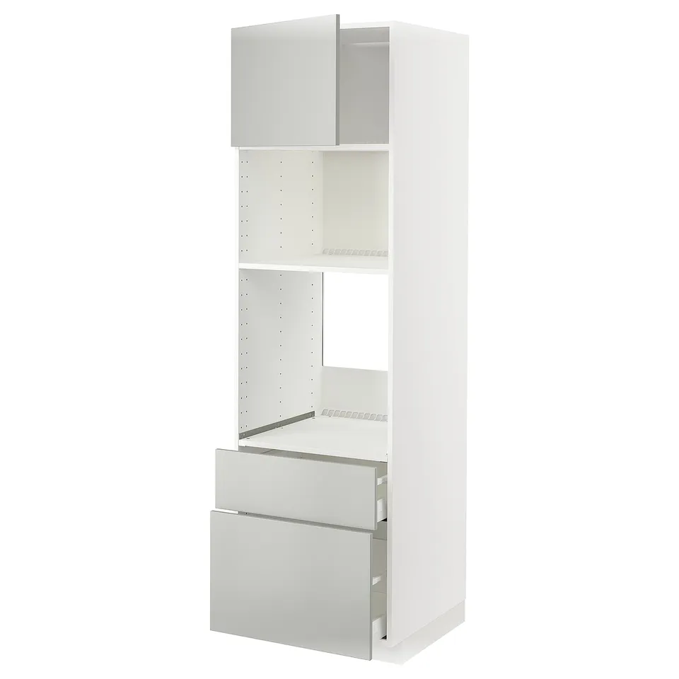 White METOD kitchen unit with light grey havstorp drawers and shelves, modern and clean.