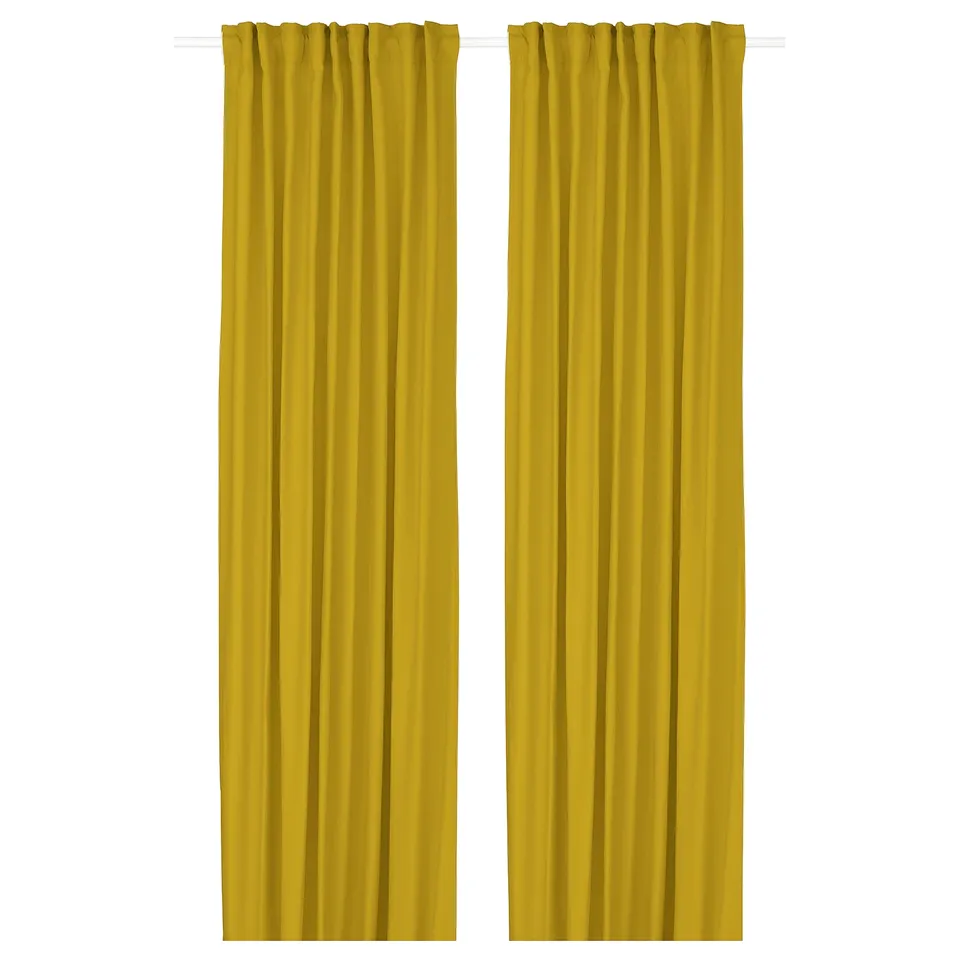 Two yellow curtains hang straight, reaching full length with heading tape at top, offering vibrant style and privacy.