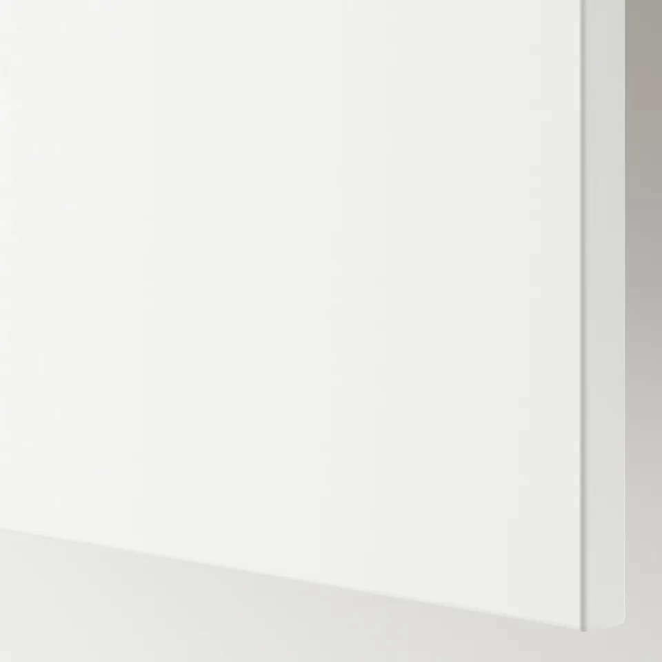 Clean, white surface with sleek, shiny finish reflecting light, indicating high-quality material.
