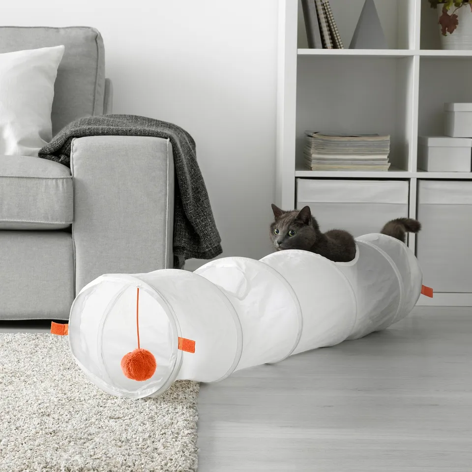 A cat play tunnel with a bell inside, providing fun and exercise for pets.