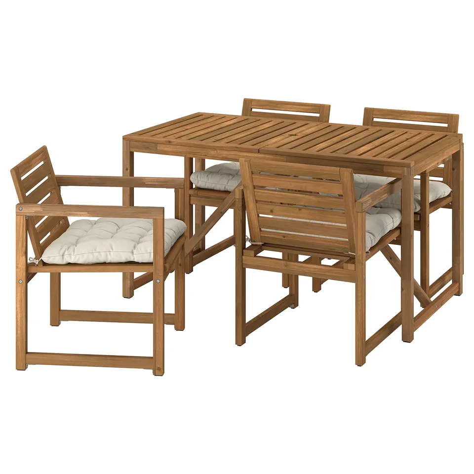 IKEAs NÄMMARÖ outdoor patio set. It includes a brown wooden table and four matching chairs with armrests and beige cushions.