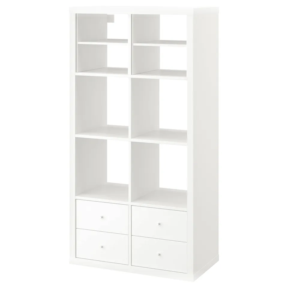 A white ikea KALLAX storage unit with multiple shelves and four drawers.