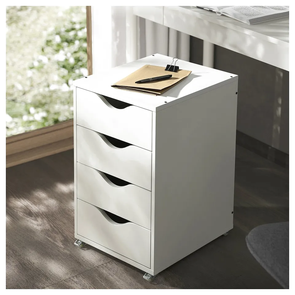 A white, 4-drawer filing cabin, ideal for storage. It four drawers, each with a curved handle. The unit stands on rolling castors for easy movement.