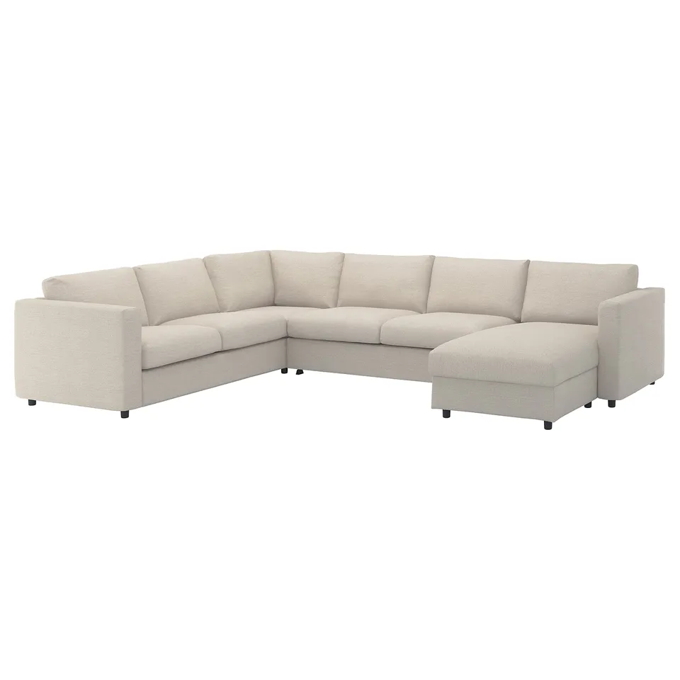 A light beige VIMLE sectional sofa with a chaise lounge. It a modern, clean design with a comfortable, inviting shape.