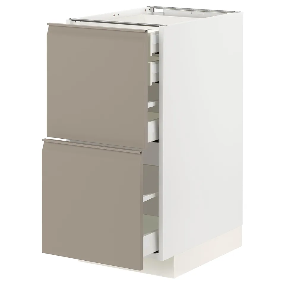Modern white kitchen unit with beige drawers, sleek handles, and built-in dampers.