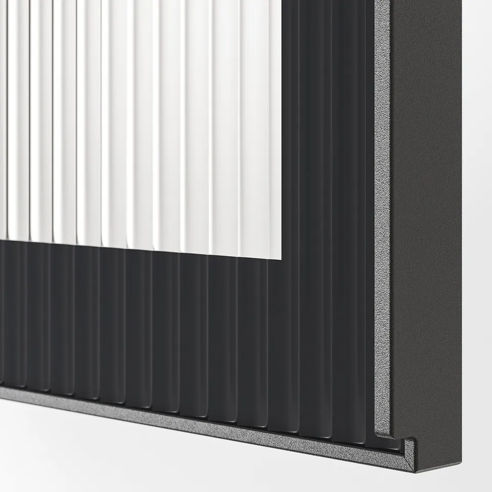 Close-up of black metal-framed, textured glass panel, showcasing sleek, modern design.