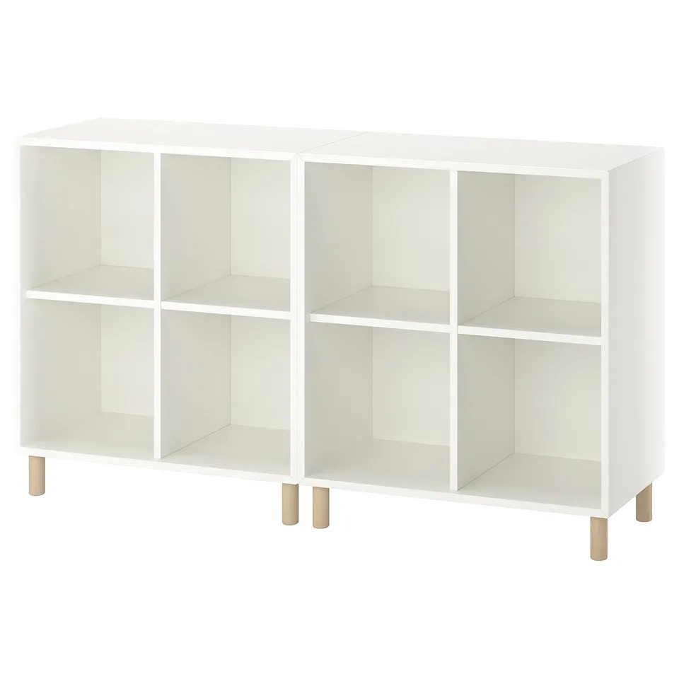 A white EKET shelf unit with wooden legs, featuring six empty compartments in a grid design.