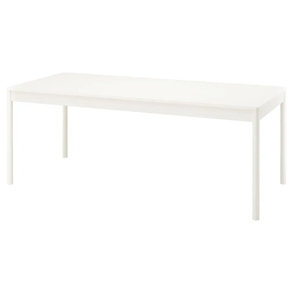 TONSTAD off-white dining table, rectangular with rounded corners and wooden legs.