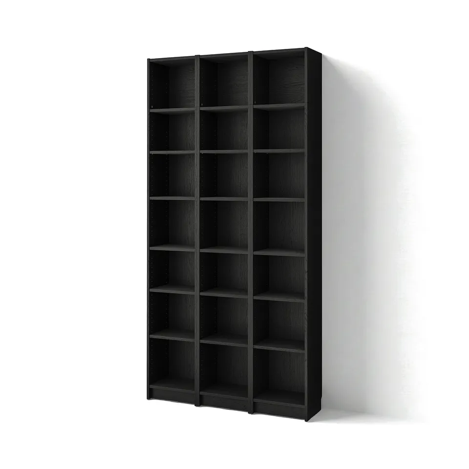 Displays a BILLY black bookcase against a white wall, featuring multiple shallow, adjustable shelves in a simple, modern design.