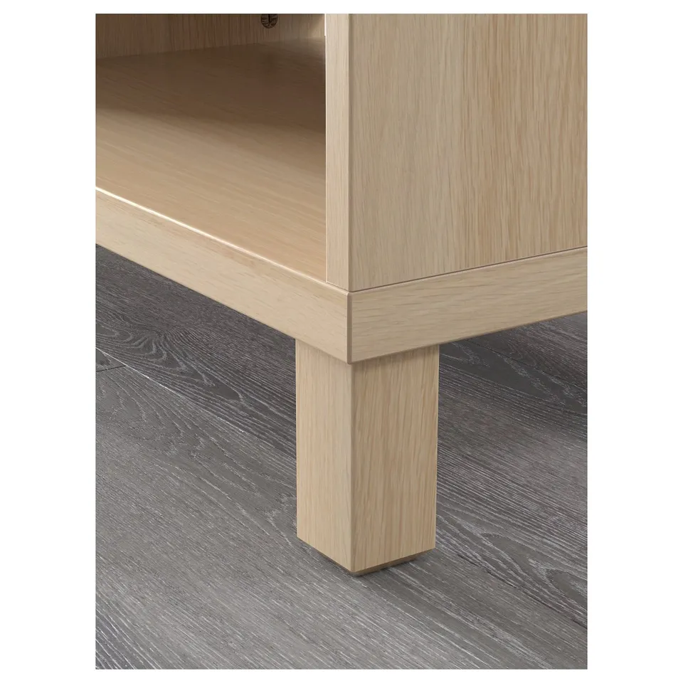 Modern light wood furniture close-up. Clean lines, sturdy build, adjustable shelves.
