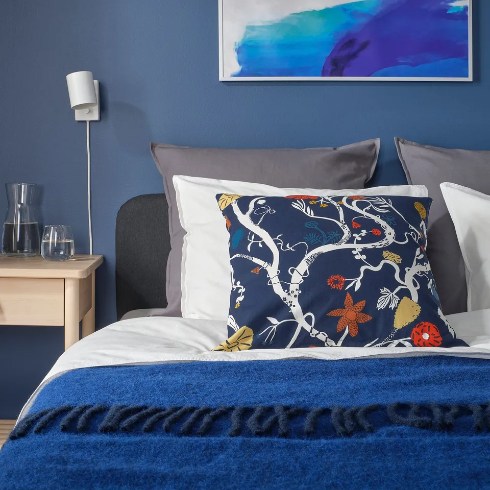 Bedroom with REVFINGERÖRT pillow, blue, cotton, floral design, large.