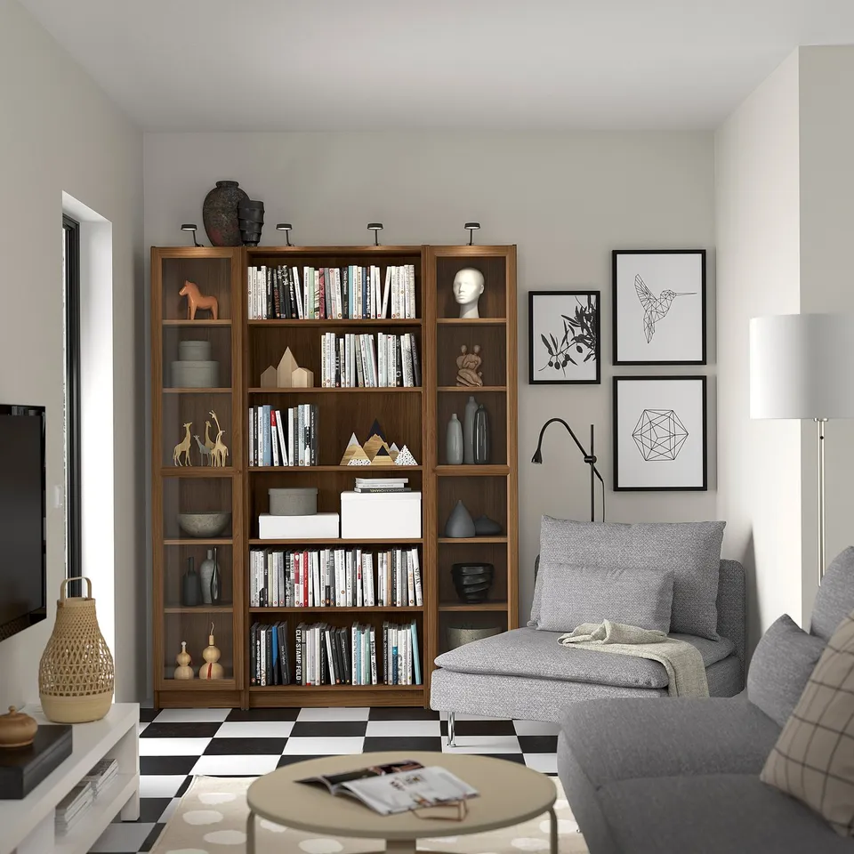 Modern living room with BILLY bookcase, sofa, coffee table, art, lamp, tv.