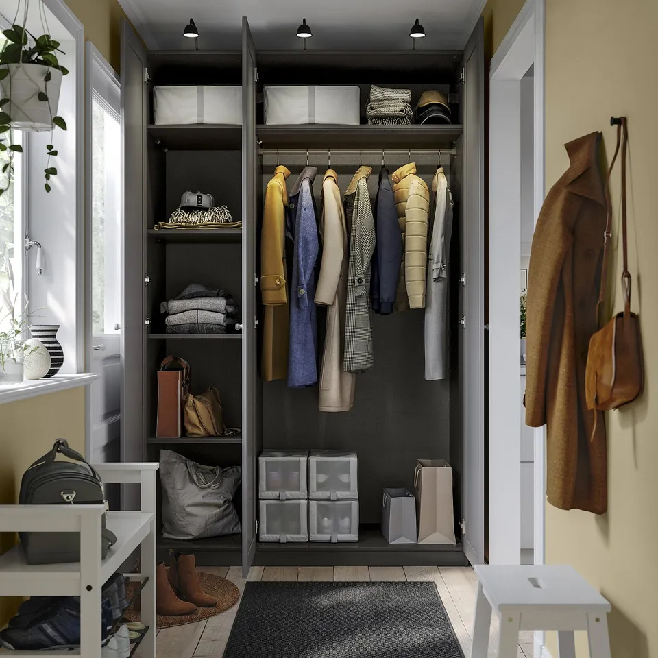 Organised wardrobe with clothes, shelves, and boxes, adjustable feet, and dampers.