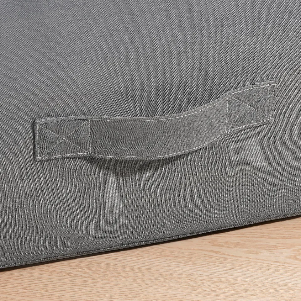 Close-up of VITHÄLL pouffes sturdy zip and fabric handle, showcasing quality craftsmanship.