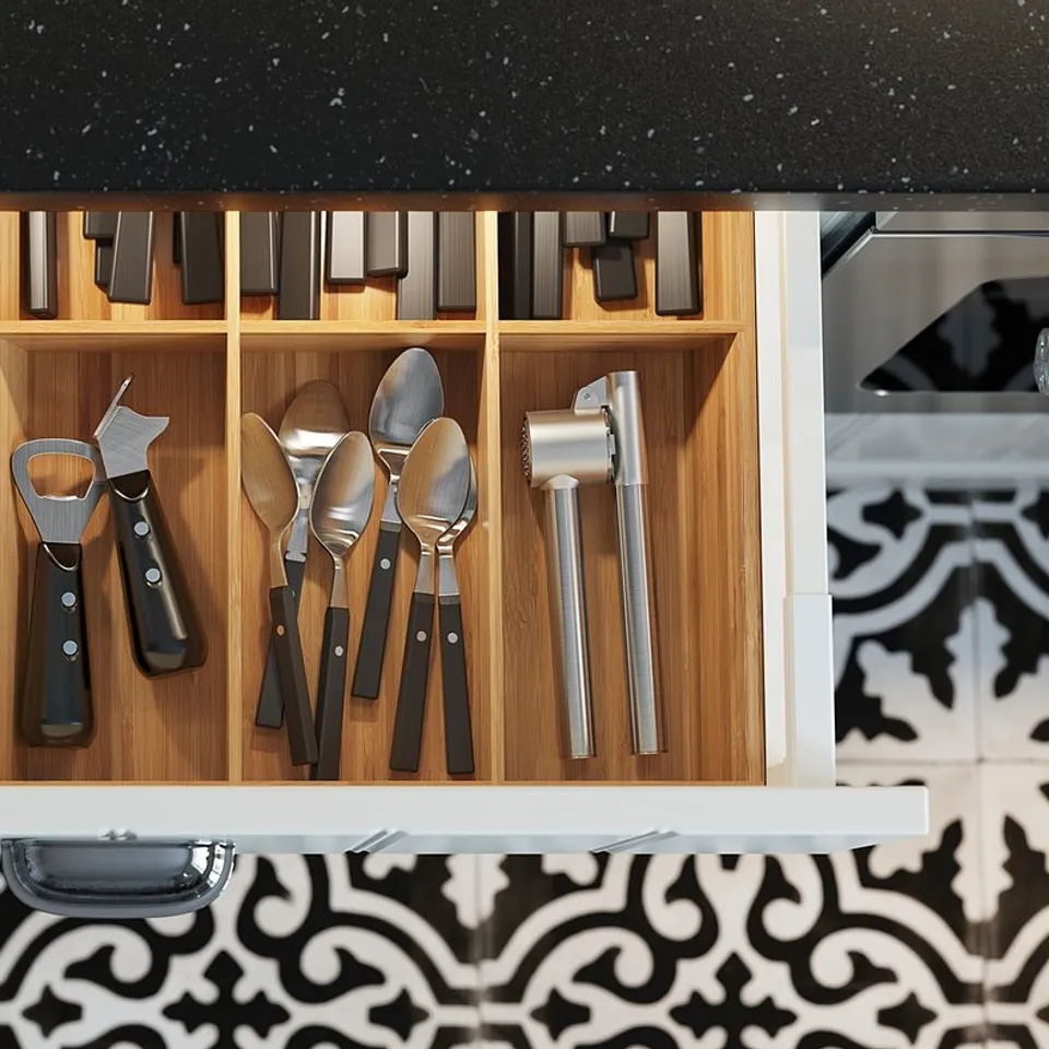 Kitchen drawer with divider, organised utensils, tools, and led light.