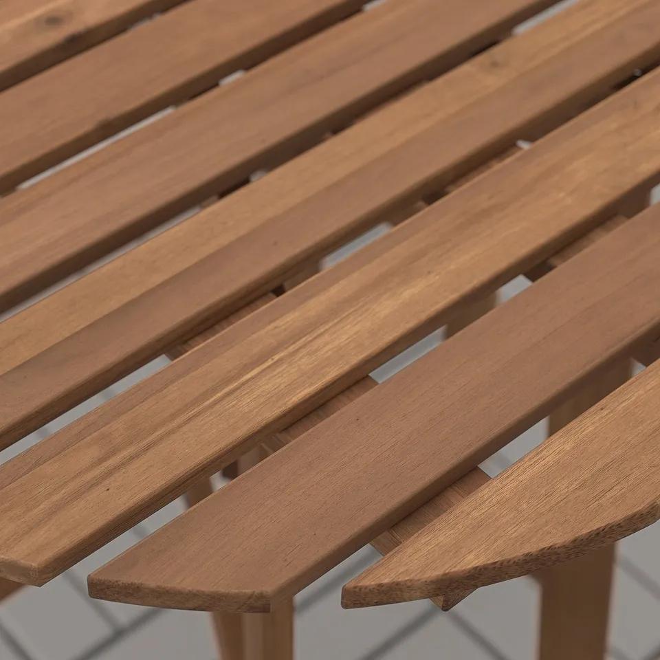 Close-up of a wooden table, showcasing its smooth, richly stained surface and perfectly aligned slats.