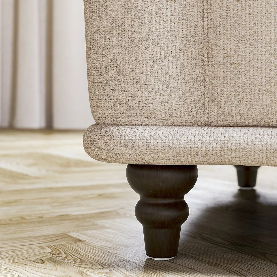 Beige sofa leg, rounded design, wood, light floor.