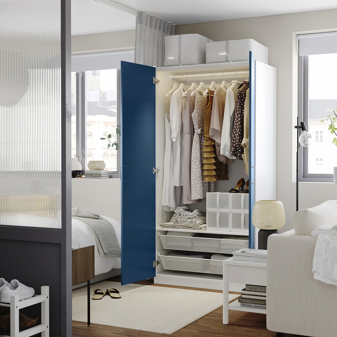 Modern blue PAX wardrobe with lighting & adjustable feet.