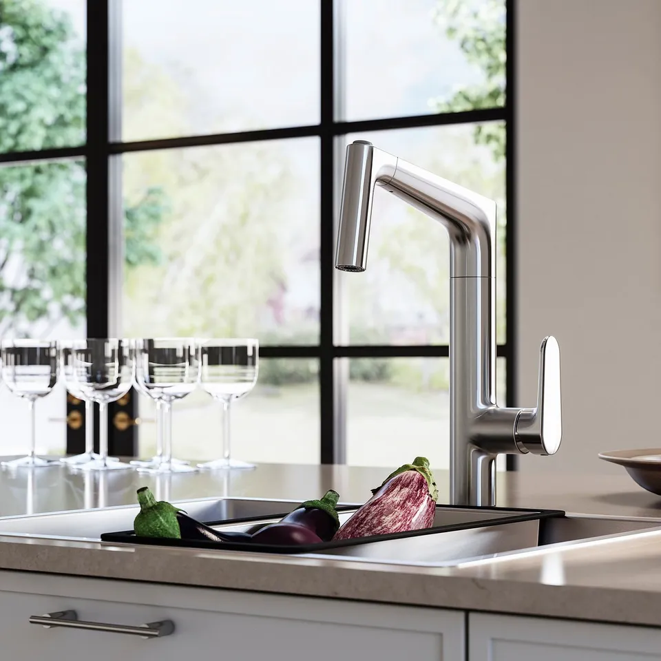 Stainless steel kitchen sink with MAJSJÖN tap, veg, wine glasses.