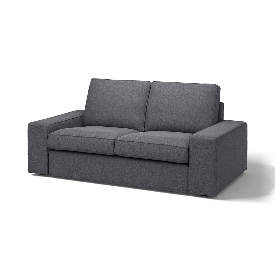 A grey KIVIK sofa with a modern, rectangular shape, featuring a durable, machine-washable polyester cover in a wool-like texture.