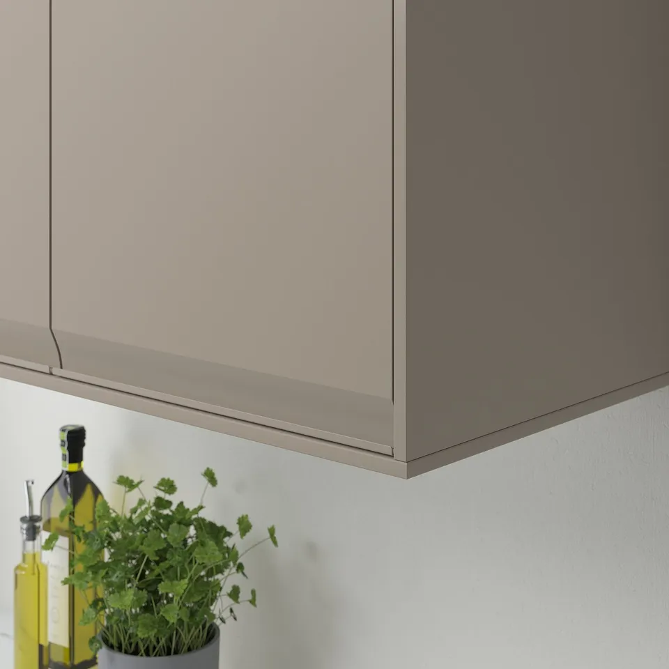 Kitchen cabinet with beige deco, herbs, and oil bottles.