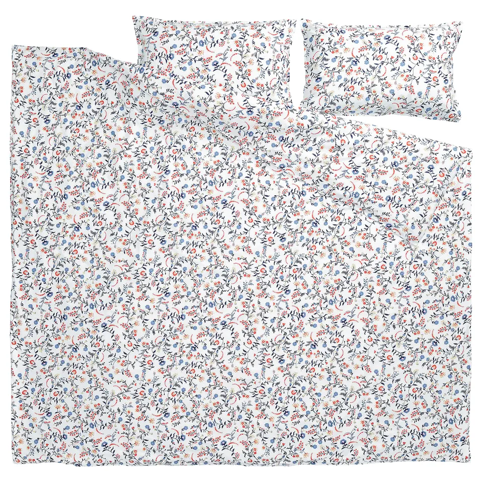 BRUDKRUSBÄR duvet set in floral white with blue and orange dots, 100% organic cotton.